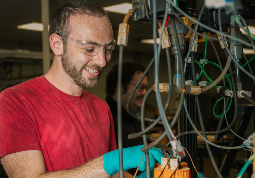 ESS employee working with electrolyte