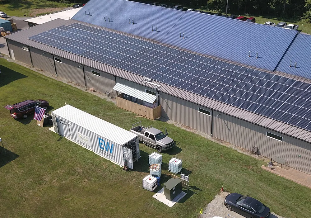 Ess energy warehouse™ installed at a battery recycling facility with solar on their roof.